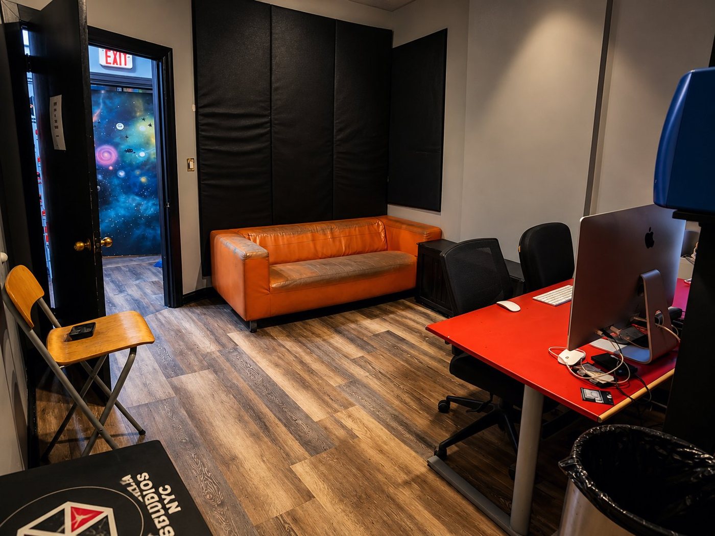 B Room lounge with orange couch and seating