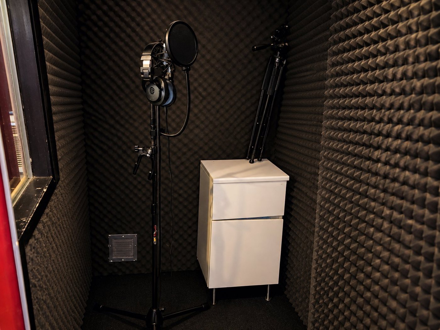 B Room vocal booth with microphone, headphones and acoustic foam